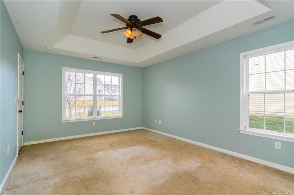 87 Yadkin Road, Unit 327 Fletcher, NC 28732 - Photo 17 of 23 an empty room with a window and a ceiling fan