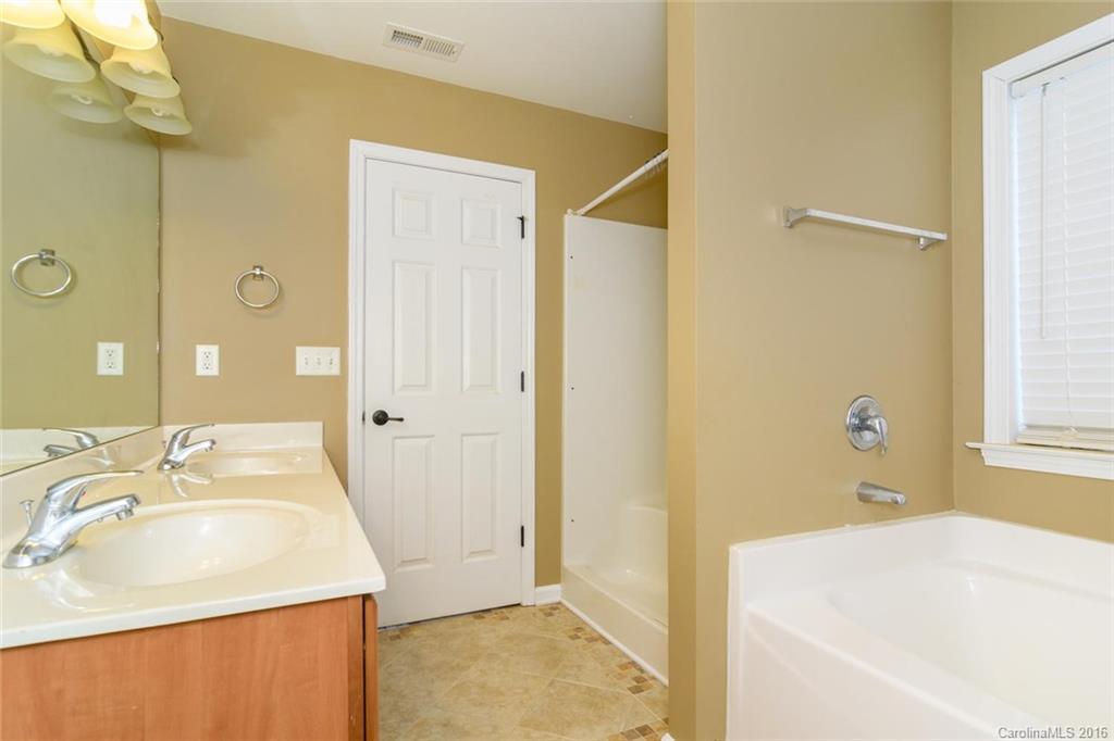 87 Yadkin Road, Unit 327 Fletcher, NC 28732 - Photo 18 of 23 a bathroom with a sink and a bathtub