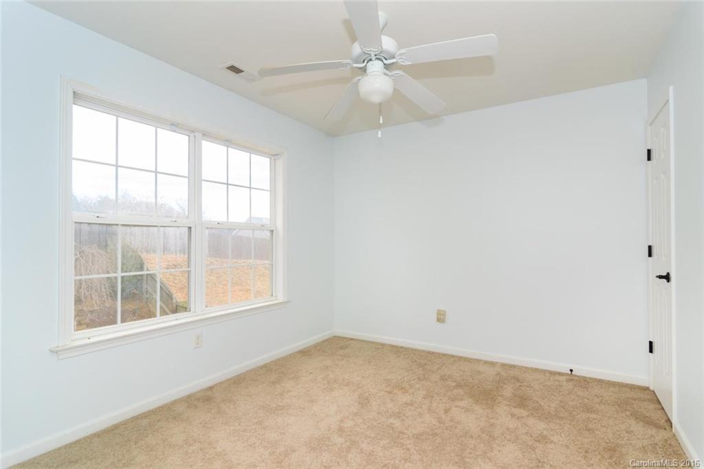 87 Yadkin Road, Unit 327 Fletcher, NC 28732 - Photo 22 of 23 an empty room with a window