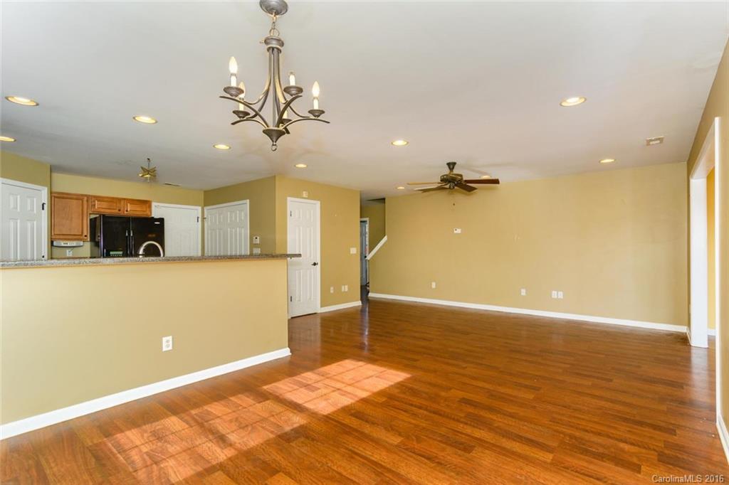 87 Yadkin Road, Unit 327 Fletcher, NC 28732 - Photo 5 of 23 a view of a kitchen with a sink and a chandelier
