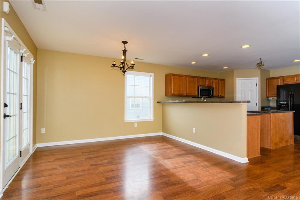 87 Yadkin Road, Unit 327 Fletcher, NC 28732 - Photo 7 of 23 a view of a kitchen with a sink a refrigerator and a window