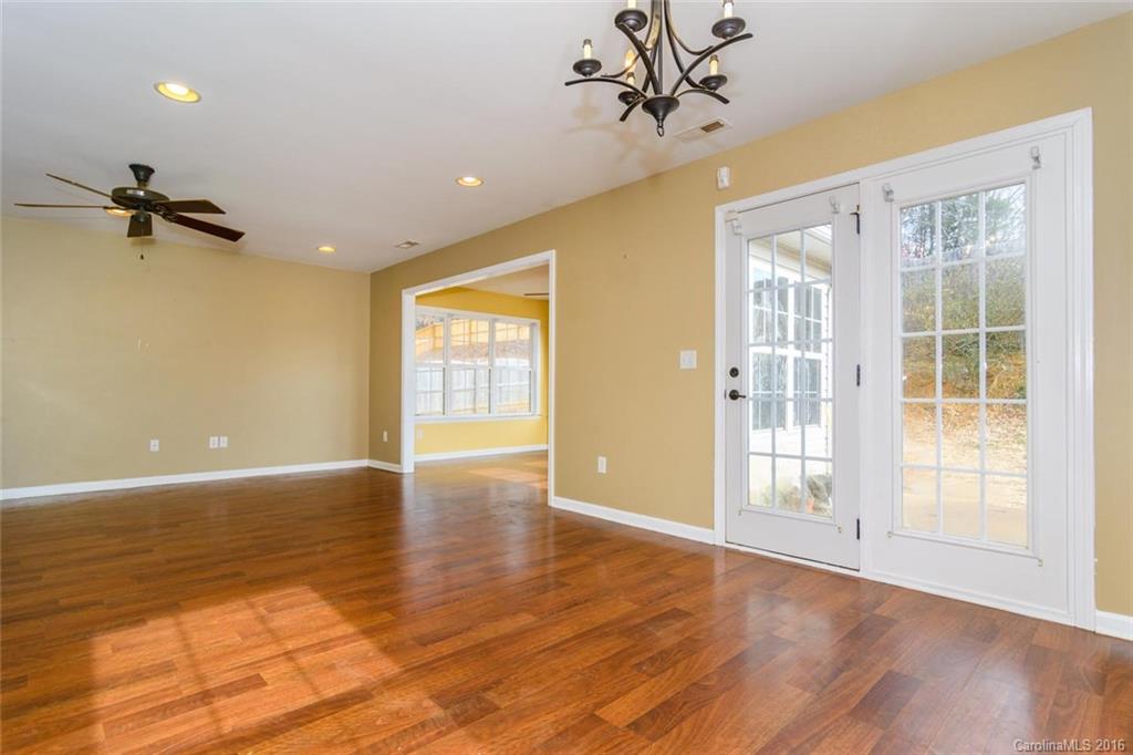 87 Yadkin Road, Unit 327 Fletcher, NC 28732 - Photo 10 of 23 a view of an empty room with a window