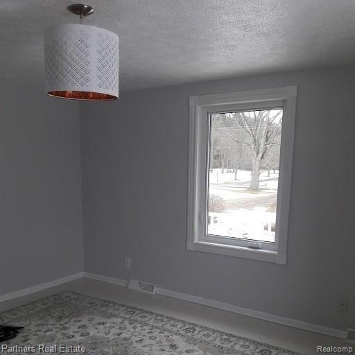 1774 West Cohoctah Road Howell, MI 48855 - Photo 13 of 19 1774 W Cohoctah Master Bedroom.jpg