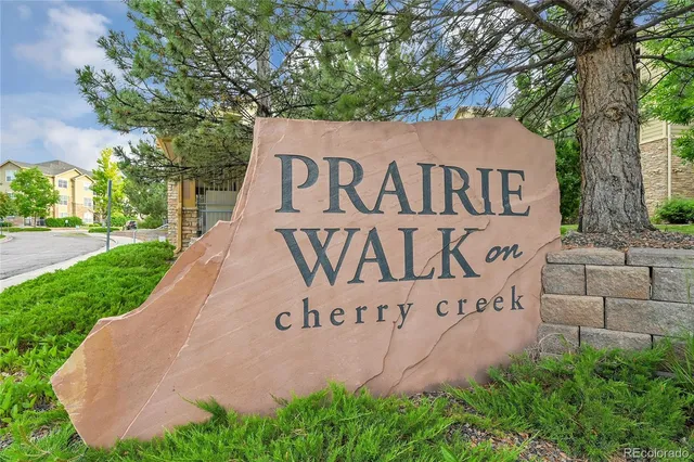 a sign that is on the side of the tree