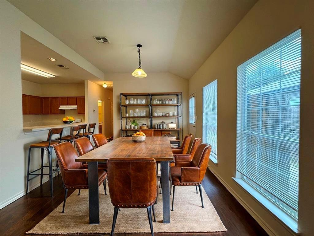 1717 Constantino Circle, Unit B Austin, TX 78745 - Photo 1 of 1 a view of a dining room with furniture window and wooden floor