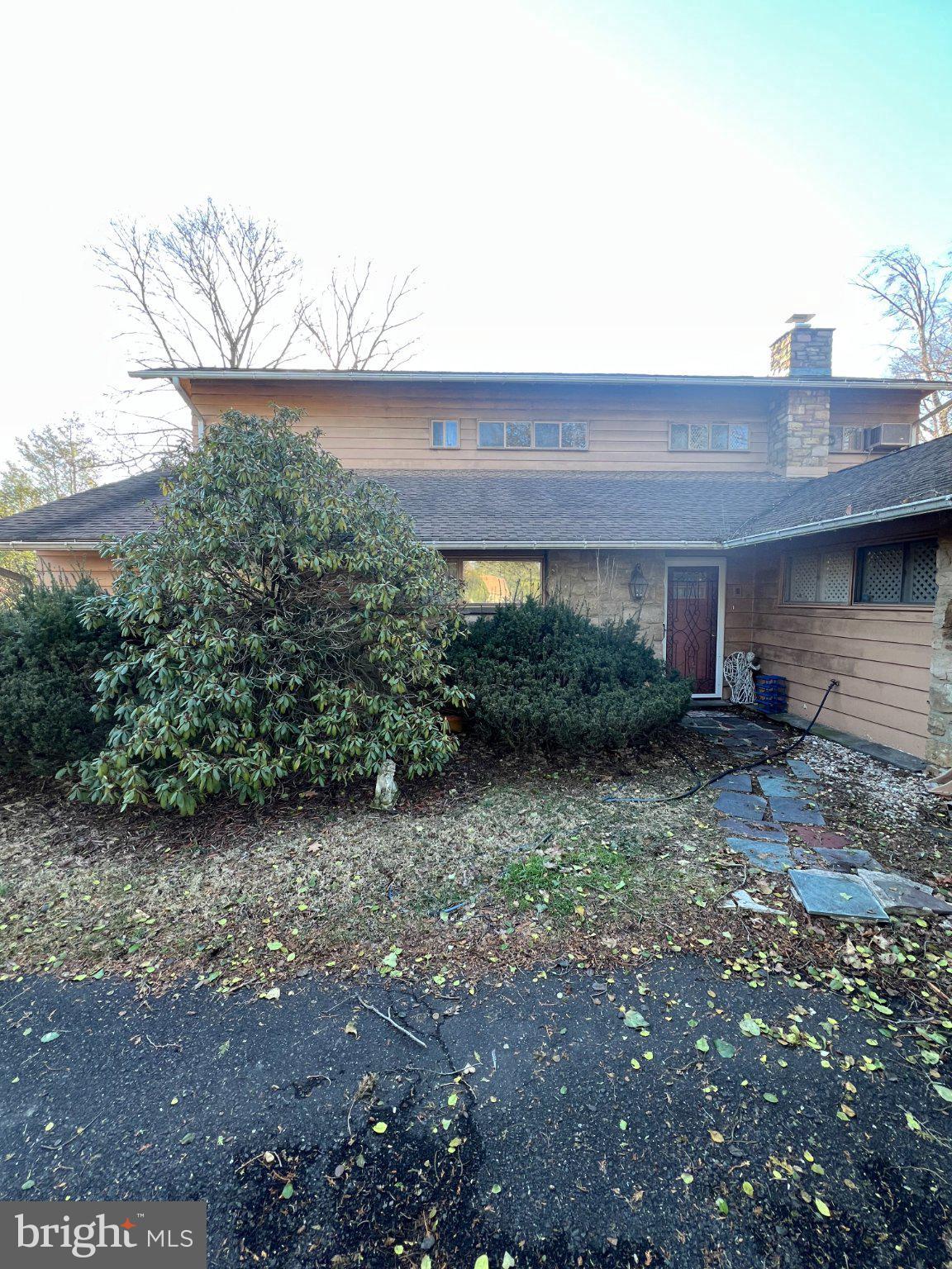 7759 Mellon Road Wyncote, PA 19095 - Photo 1 of 9 Charming home with lush greenery.