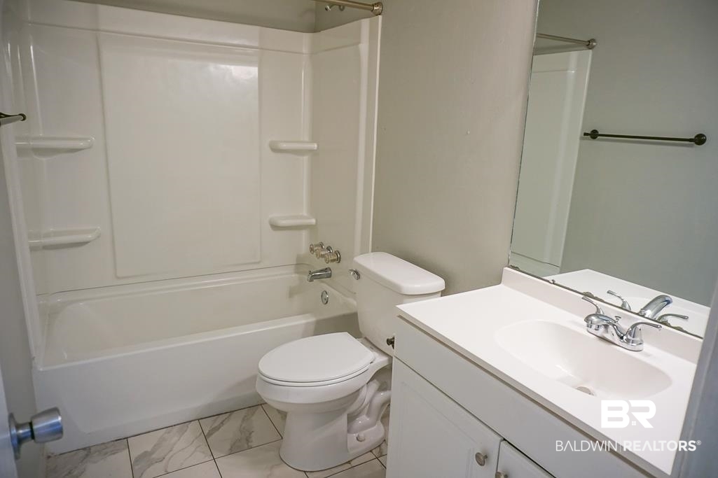 4366 Fathbrook Lane Mobile, AL 36693 - Photo 14 of 14 Full bath with vanity, shower combination, toilet, and marble finish floors