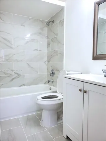 a view of a room that has a window in it