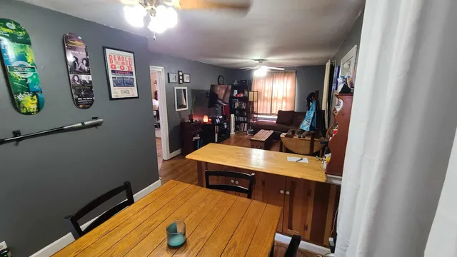 a room with wooden floor and furniture