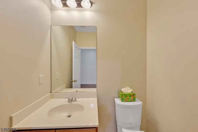 805 Deluca Road, Unit 805 Belleville, NJ 07109 - Photo 13 of 35 a bathroom with a sink and a mirror