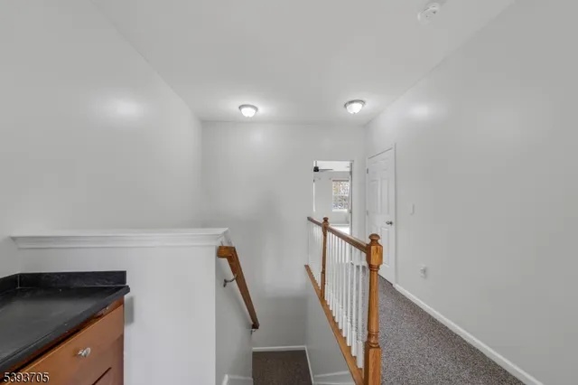 a view of a hallway with staircase