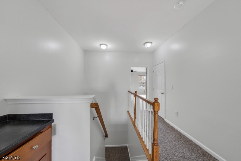 805 Deluca Road, Unit 805 Belleville, NJ 07109 - Photo 15 of 35 a view of a hallway with staircase
