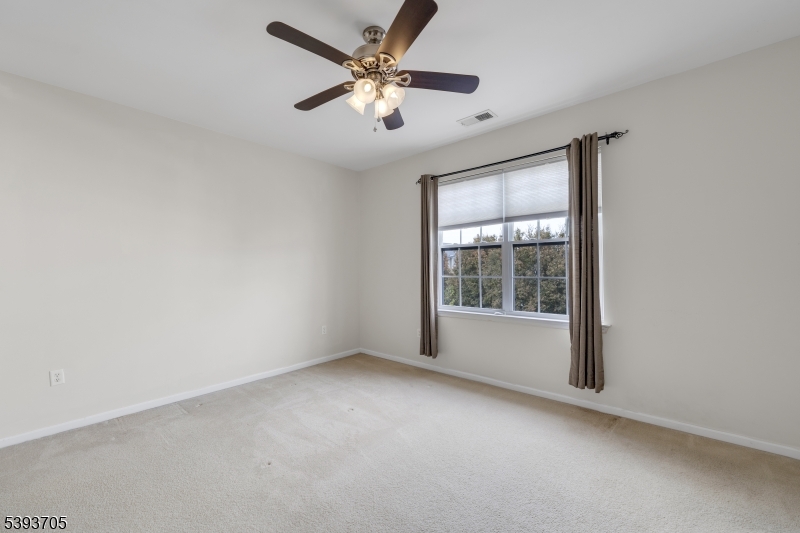 805 Deluca Road, Unit 805 Belleville, NJ 07109 - Photo 17 of 35 an empty room with a window