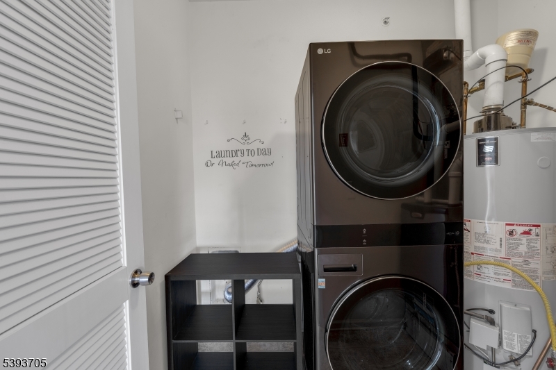 805 Deluca Road, Unit 805 Belleville, NJ 07109 - Photo 21 of 35 a view of a hallway with washer and dryer