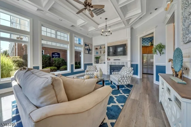 a living room with furniture fireplace and a flat screen tv