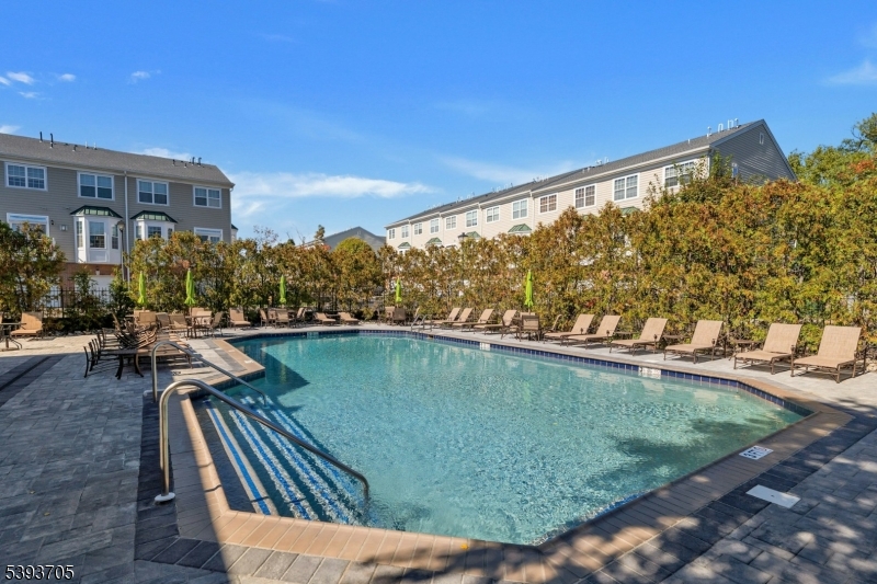 805 Deluca Road, Unit 805 Belleville, NJ 07109 - Photo 33 of 35 a view of swimming pool outdoor seating and city view
