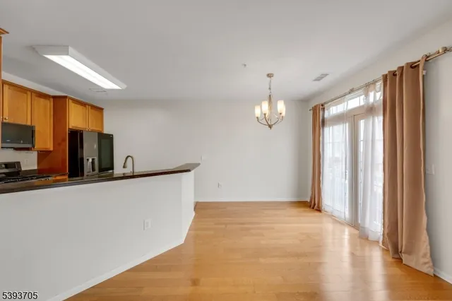 a view of kitchen and wooden floor