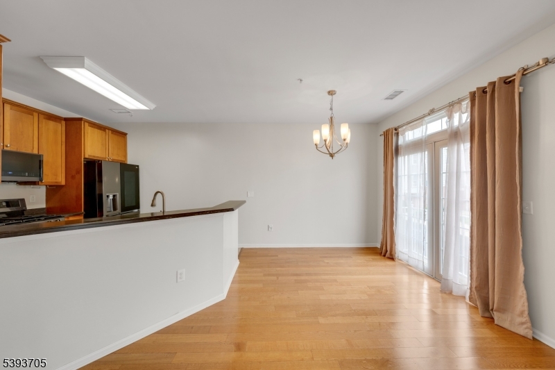 805 Deluca Road, Unit 805 Belleville, NJ 07109 - Photo 8 of 35 a view of kitchen and wooden floor