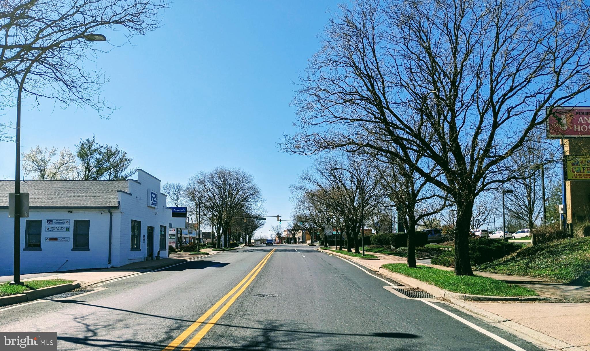 26530 Ridge Road Damascus, MD 20872 - Photo 5 of 6 a view of a house with a yard and tree s