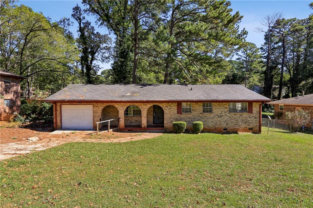 1672 Camperdown Circle Decatur, GA 30035 - Photo 1 of 1 a front view of a house with yard and large tree