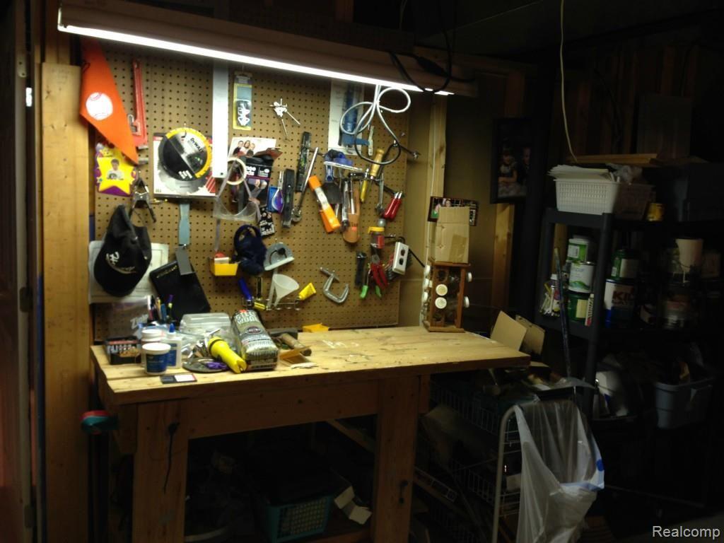 2556 Ravineside South Howell, MI 48843 - Photo 34 of 40 Work bench in basment