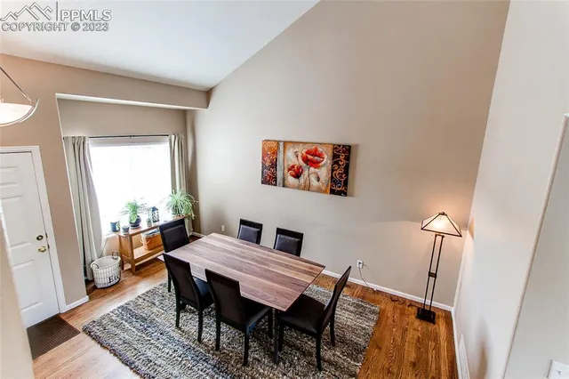 a view of a dining room with furniture window and wooden floor