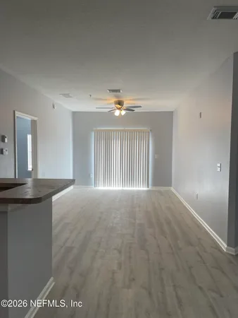 a view of an empty room and window