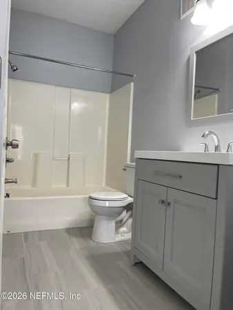a bathroom with a toilet a sink and a bathtub