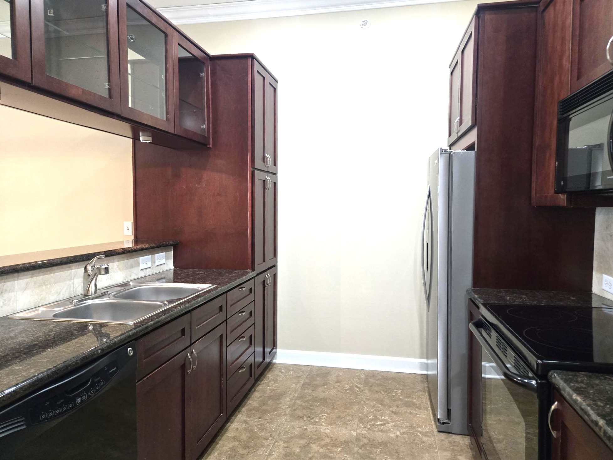 1900 Genesee Street, Unit 207 Houston, TX 77006 - Photo 9 of 50 Fantastic kitchen with rich color cabinets.