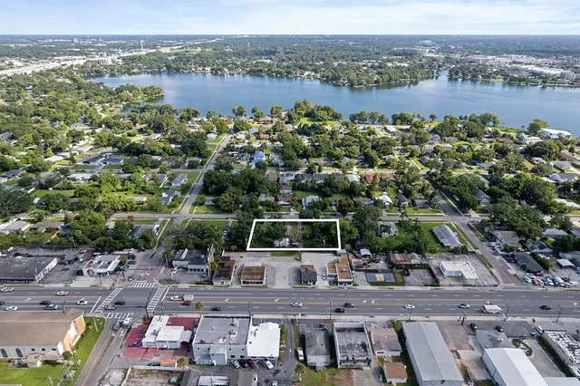 an aerial view of a city with lake view