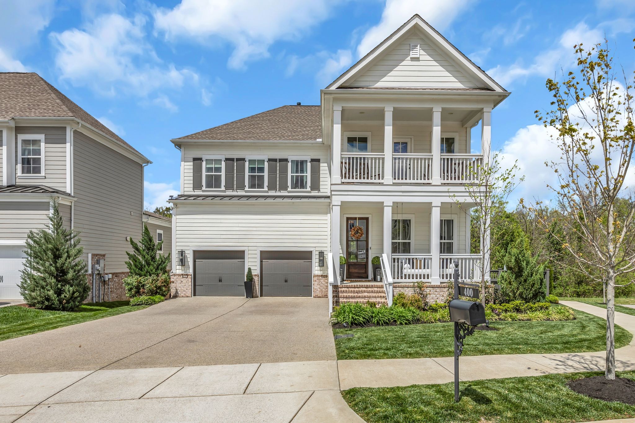 a front view of a house with a garden