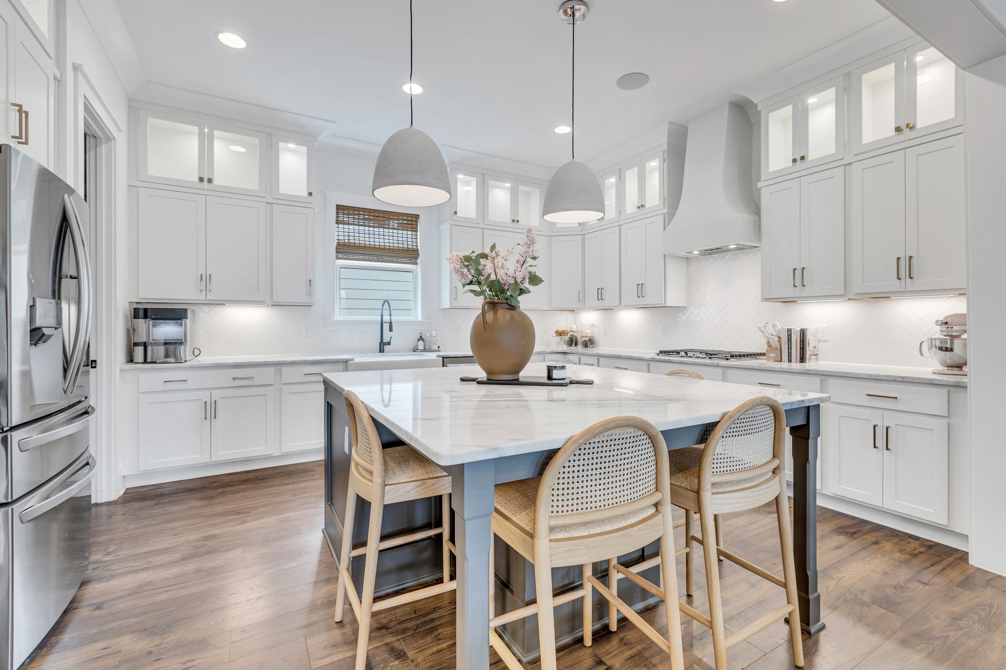 400 Dewar Drive Franklin, TN 37064 - Photo 16 of 64 a kitchen with granite countertop white cabinets and stainless steel appliances