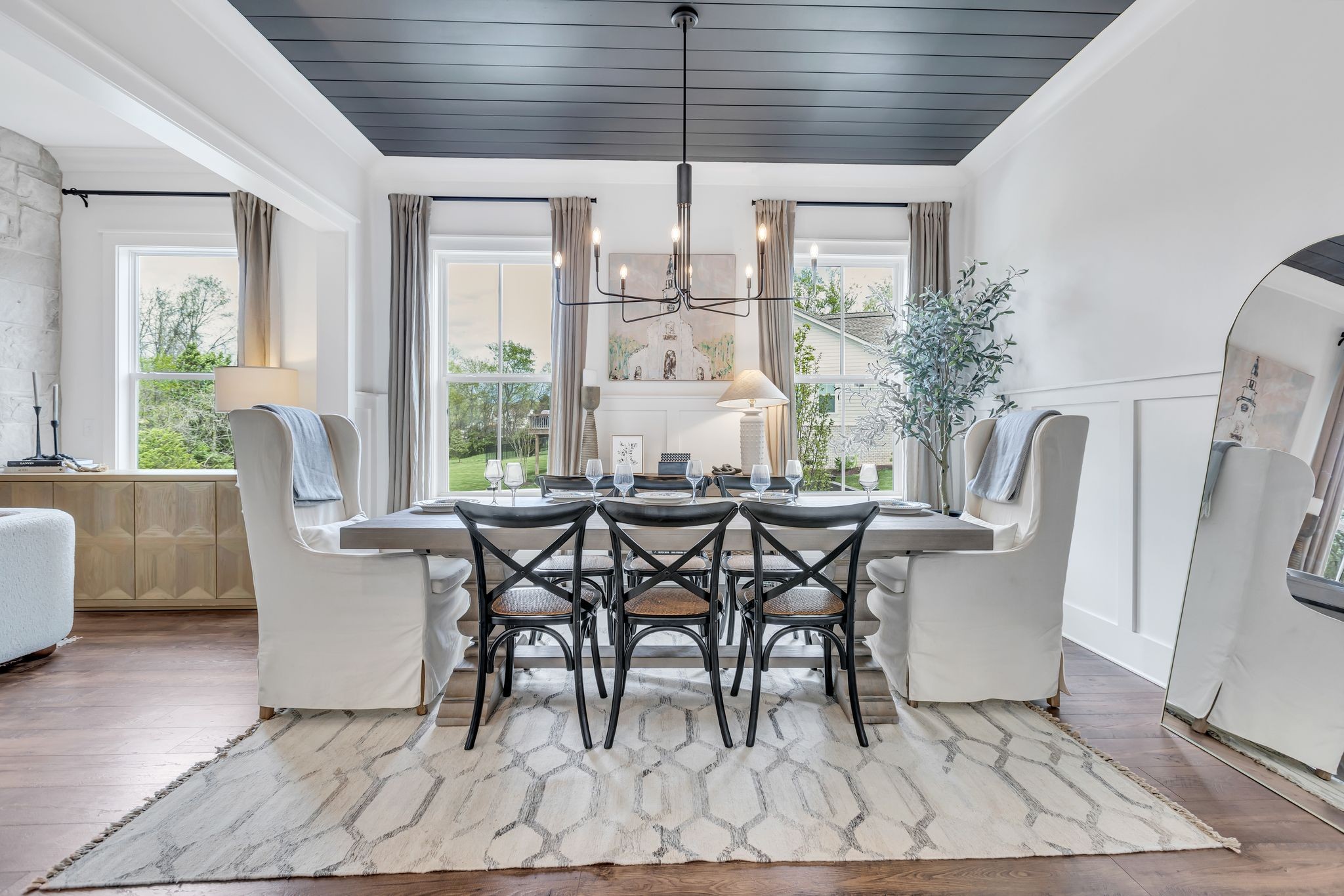 400 Dewar Drive Franklin, TN 37064 - Photo 21 of 64 a dining room with furniture a chandelier and wooden floor