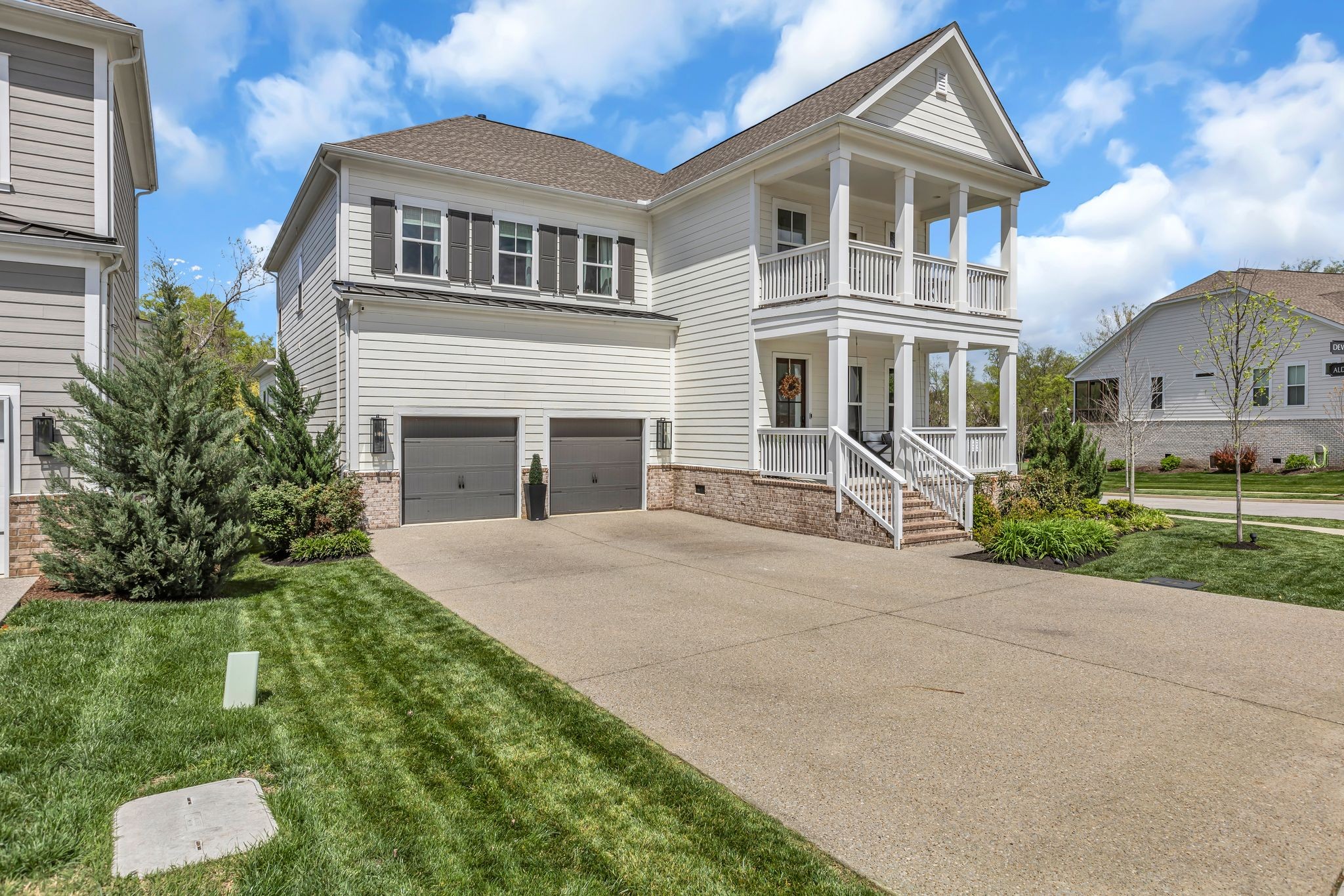 400 Dewar Drive Franklin, TN 37064 - Photo 3 of 64 a front view of a house with a yard and potted plants