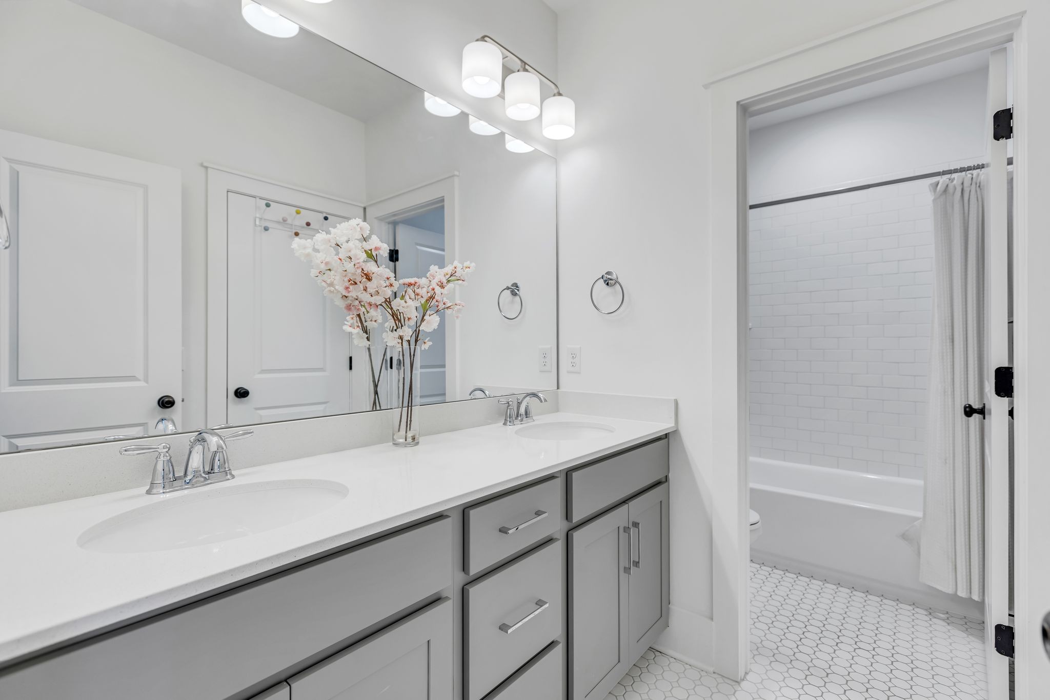 400 Dewar Drive Franklin, TN 37064 - Photo 39 of 64 a bathroom with a sink double vanity granite tub shower and a mirror