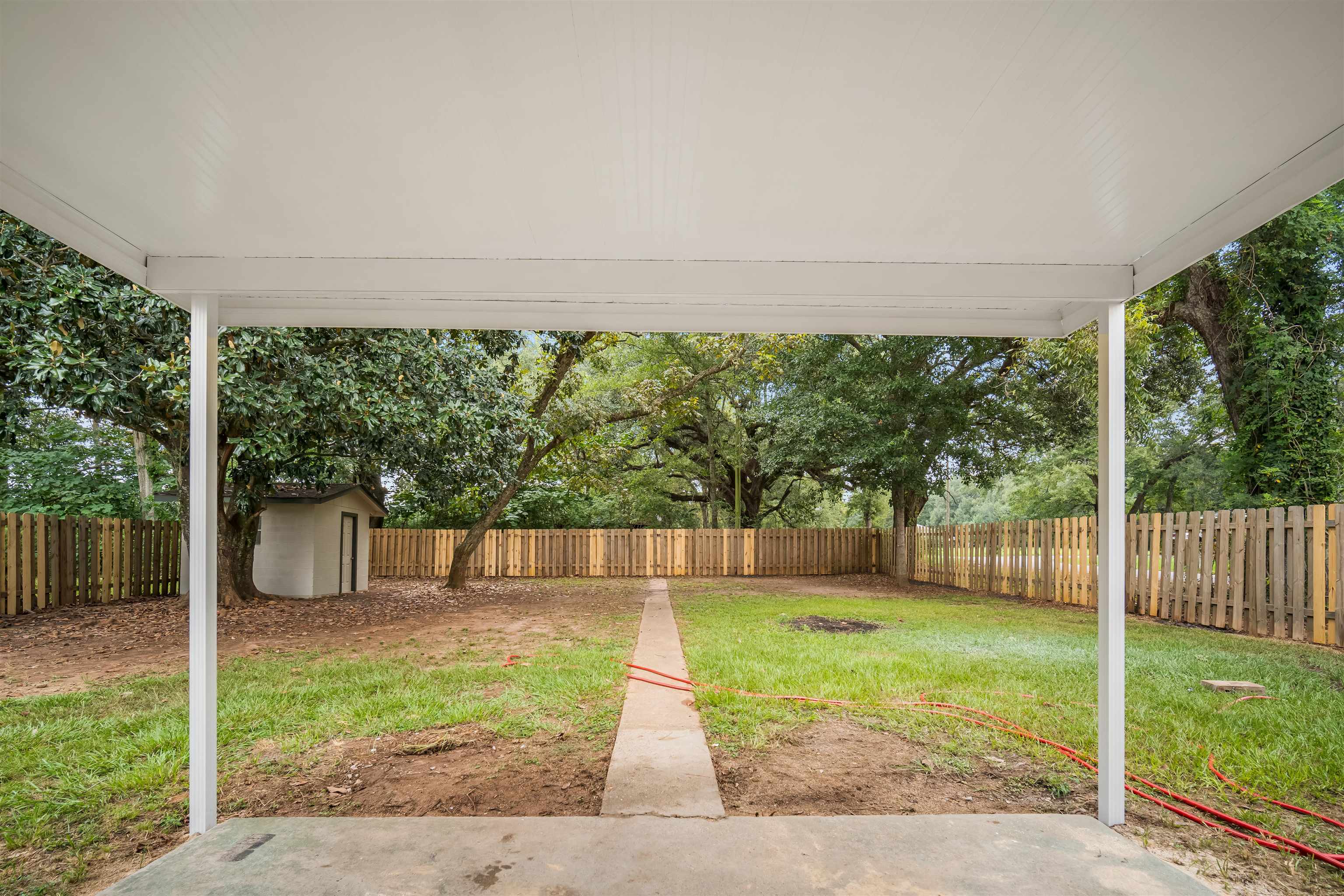9149 County Road 64, Unit 64 Daphne, AL 36526 - Photo 22 of 24 Covered Back Patio