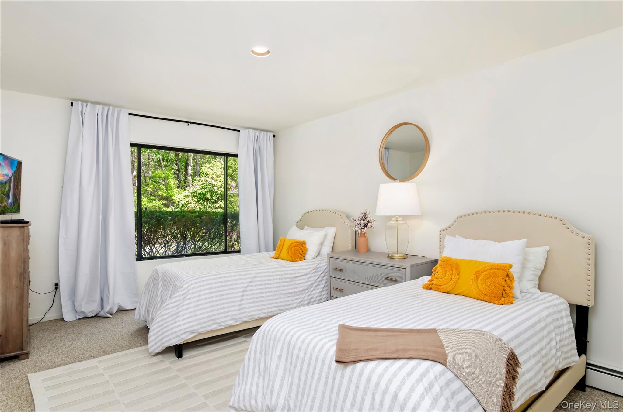 24 North Quarter Road Westhampton, NY 11977 - Photo 17 of 27 a bedroom with 2 bed and a window