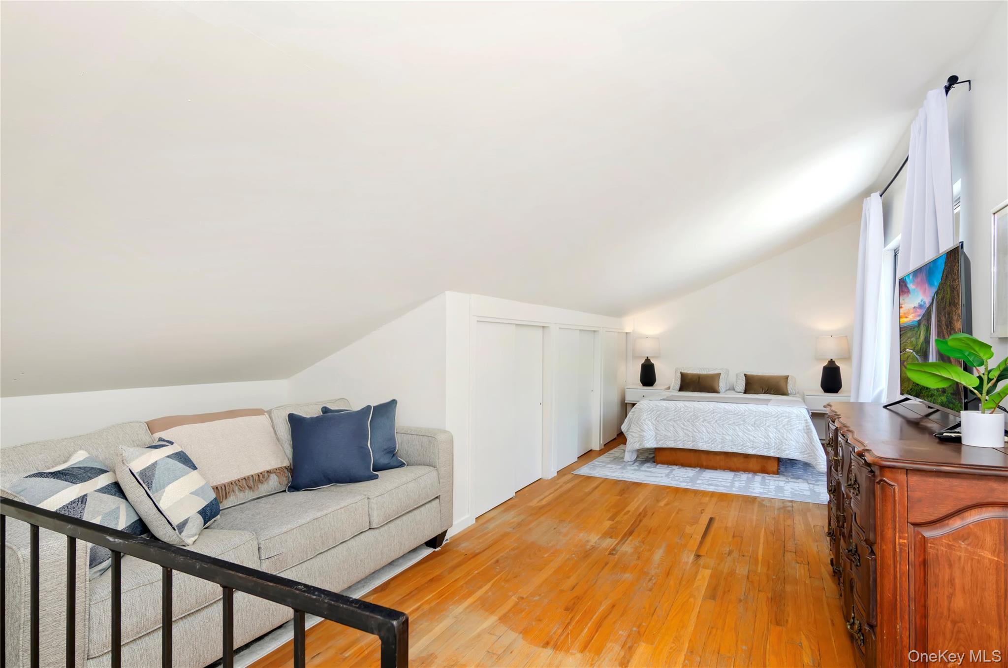 24 North Quarter Road Westhampton, NY 11977 - Photo 19 of 27 a bed room with furniture and a bed