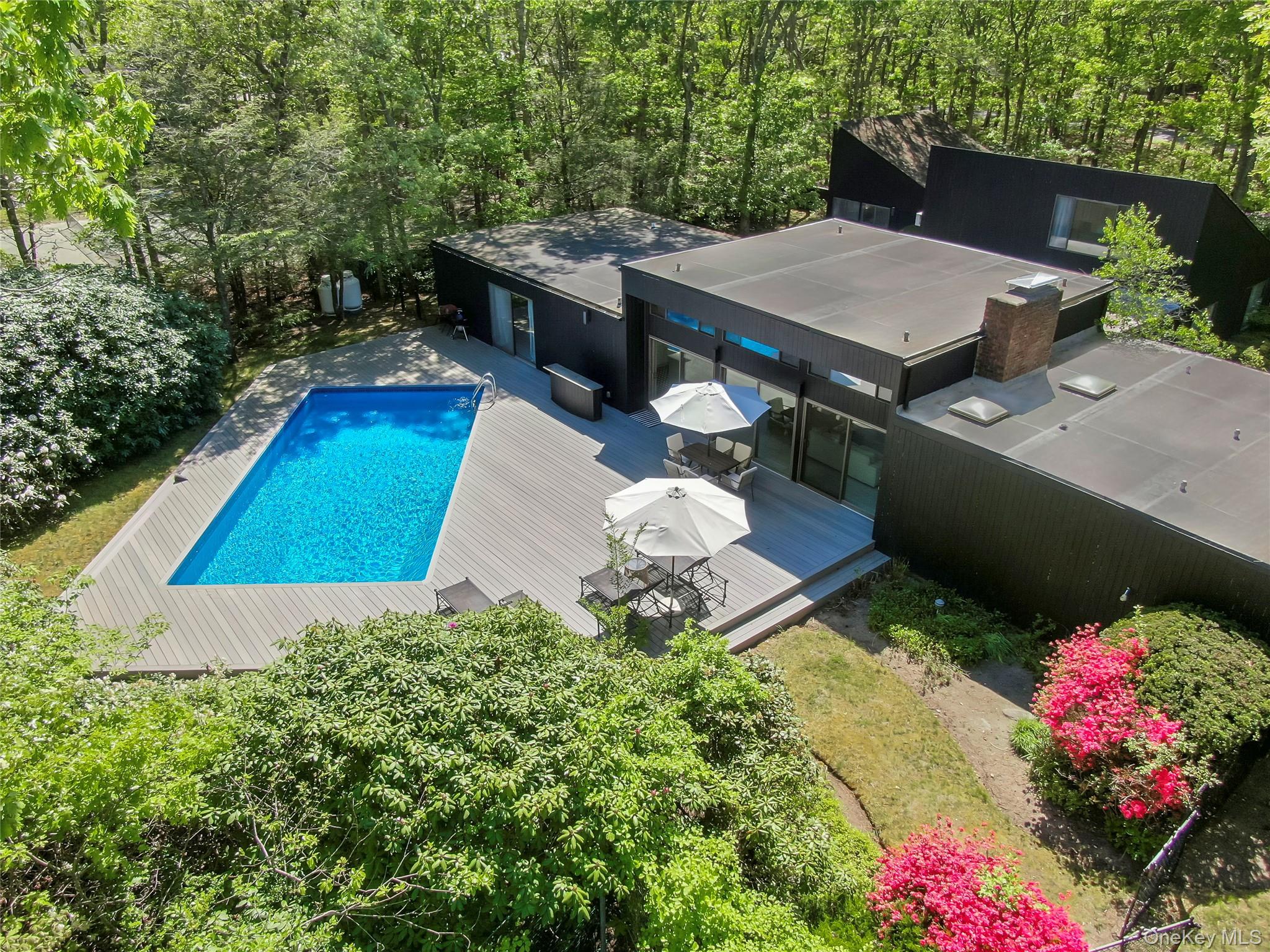 24 North Quarter Road Westhampton, NY 11977 - Photo 2 of 27 swimming pool view with a seating space