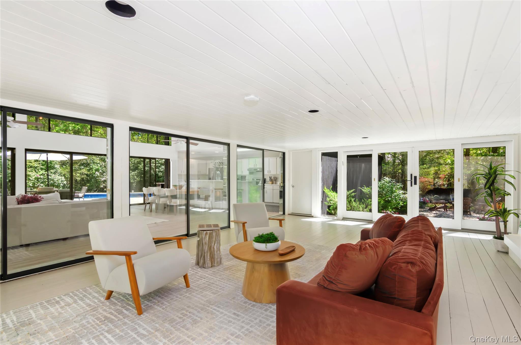 24 North Quarter Road Westhampton, NY 11977 - Photo 3 of 27 a living room with furniture and large windows