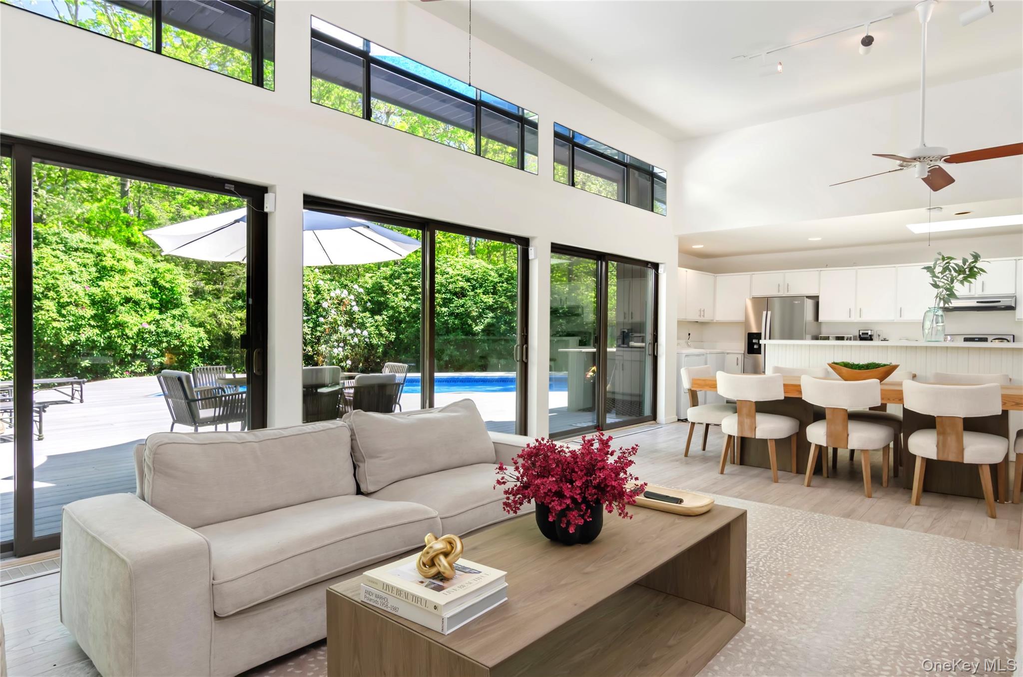 24 North Quarter Road Westhampton, NY 11977 - Photo 4 of 27 a living room with furniture and a large window