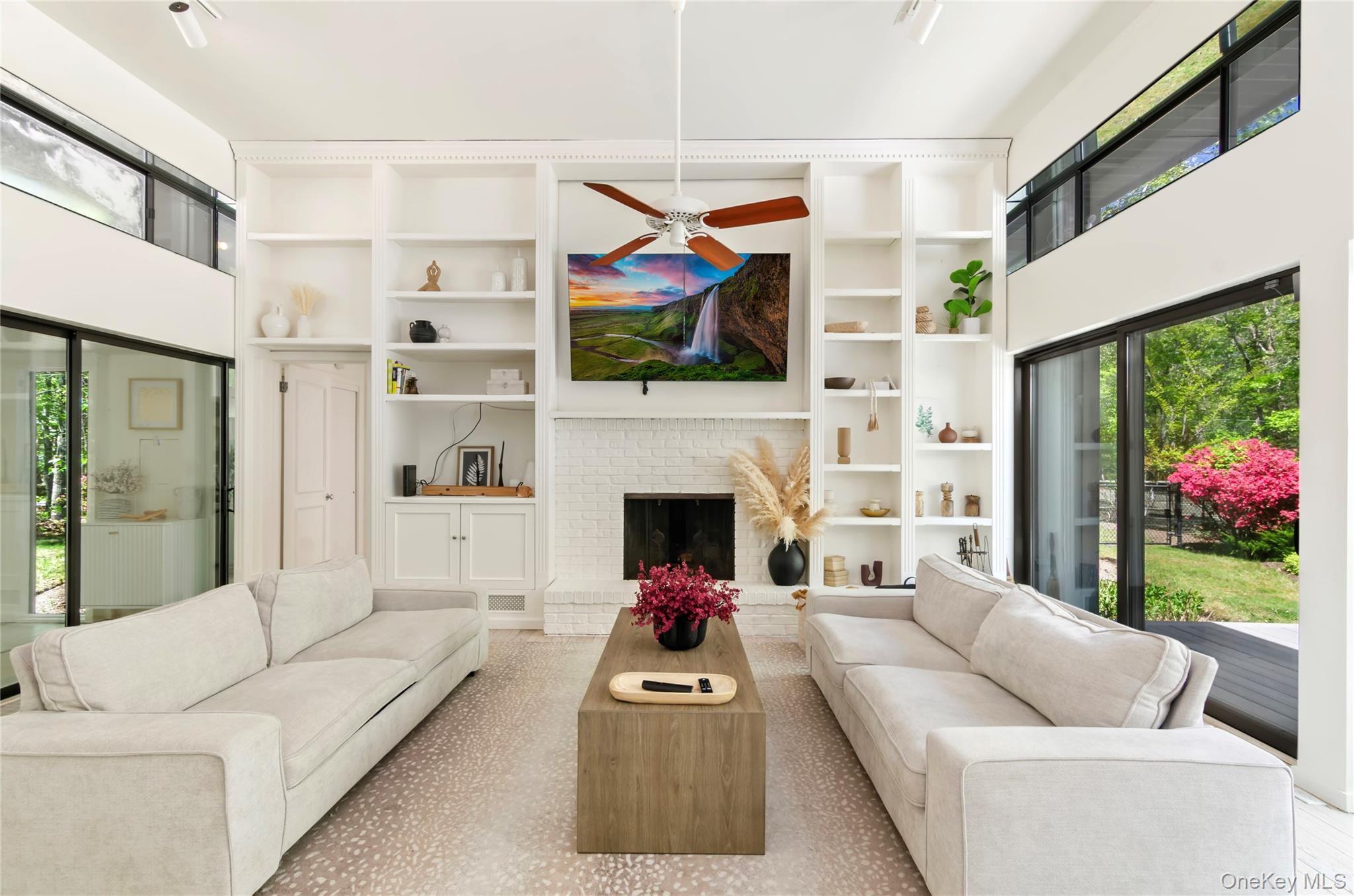 24 North Quarter Road Westhampton, NY 11977 - Photo 5 of 27 a living room with furniture fireplace and flat screen tv