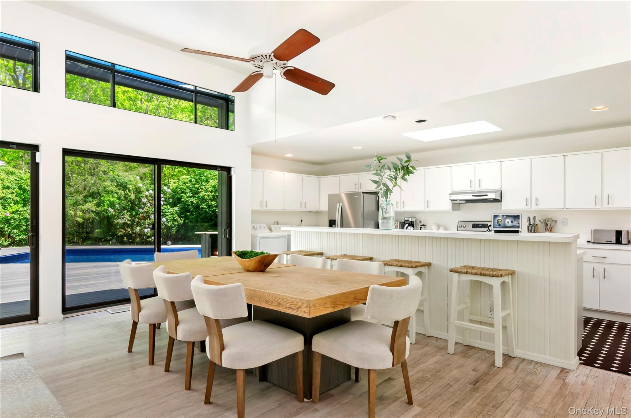 24 North Quarter Road Westhampton, NY 11977 - Photo 6 of 27 a large kitchen with a table and chairs in it