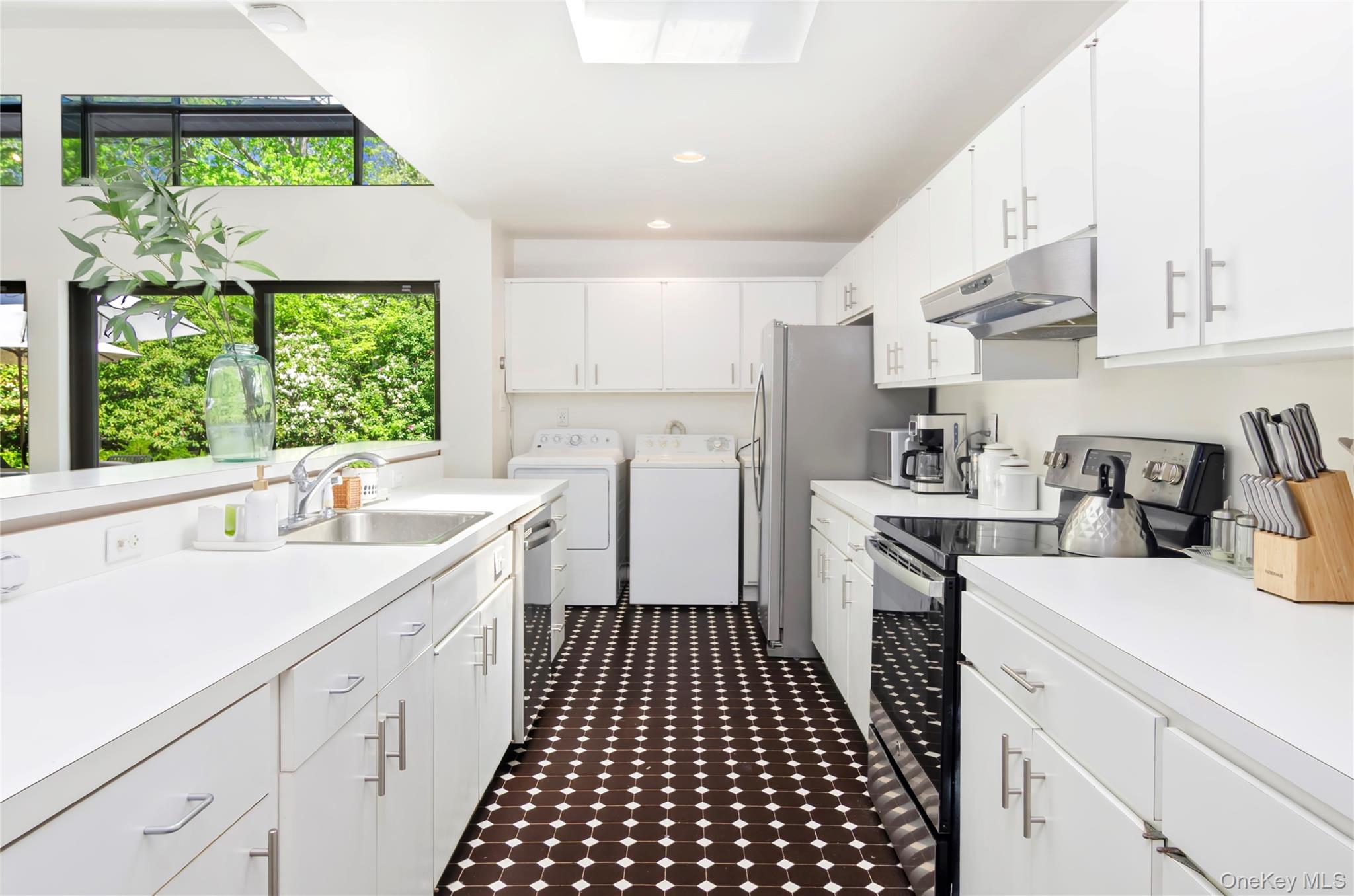 24 North Quarter Road Westhampton, NY 11977 - Photo 8 of 27 a kitchen with a sink a stove a refrigerator and a stove