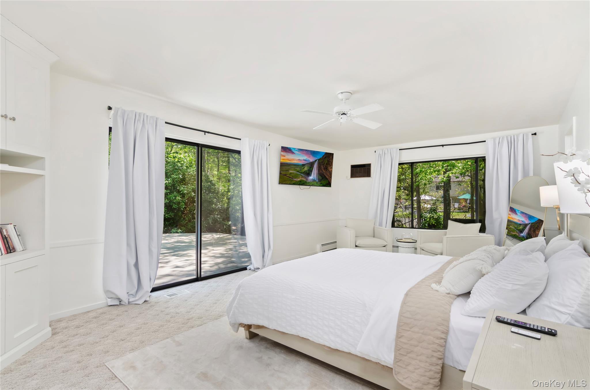 24 North Quarter Road Westhampton, NY 11977 - Photo 9 of 27 a bedroom with a bed and a window