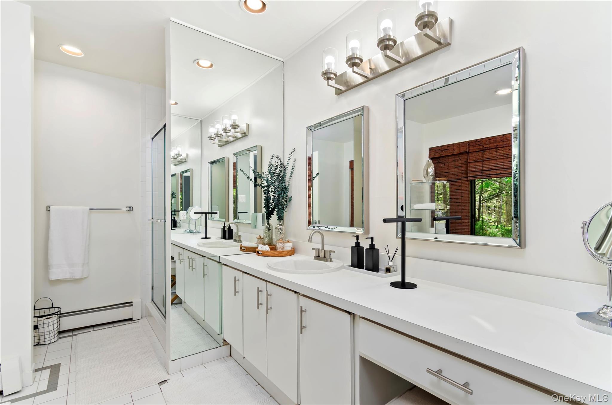 24 North Quarter Road Westhampton, NY 11977 - Photo 10 of 27 a bathroom with a double vanity sink mirror and bathtub