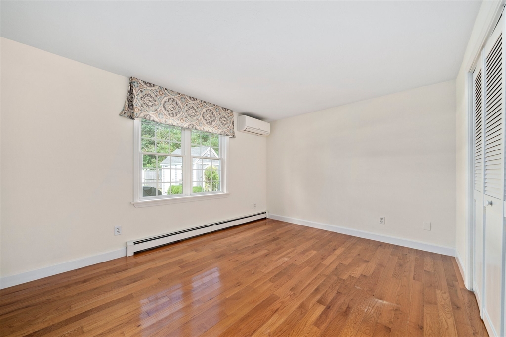 103 Williston Road Bourne, MA 02562 - Photo 14 of 40 an empty room with wooden floor and windows