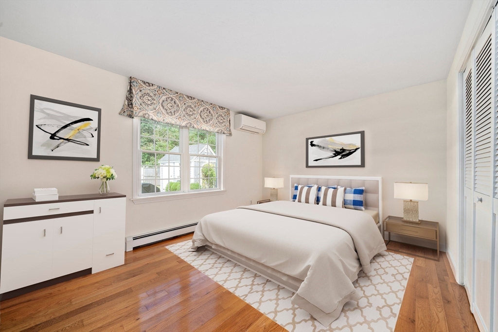 103 Williston Road Bourne, MA 02562 - Photo 15 of 40 a bedroom with a large bed and a window
