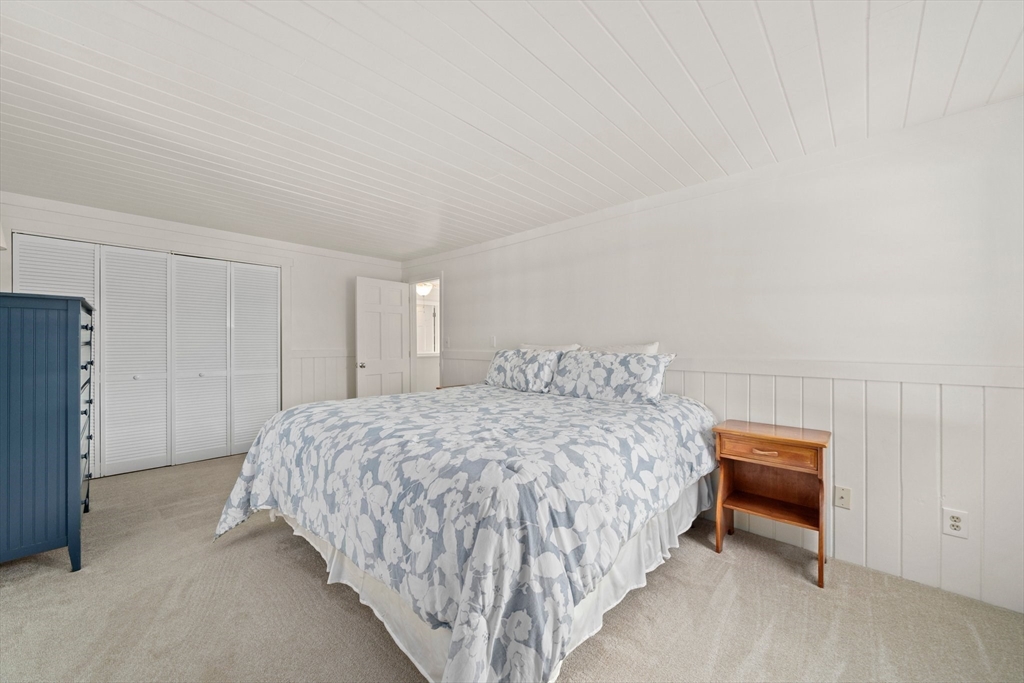 103 Williston Road Bourne, MA 02562 - Photo 19 of 40 a bedroom with a bed and a closet