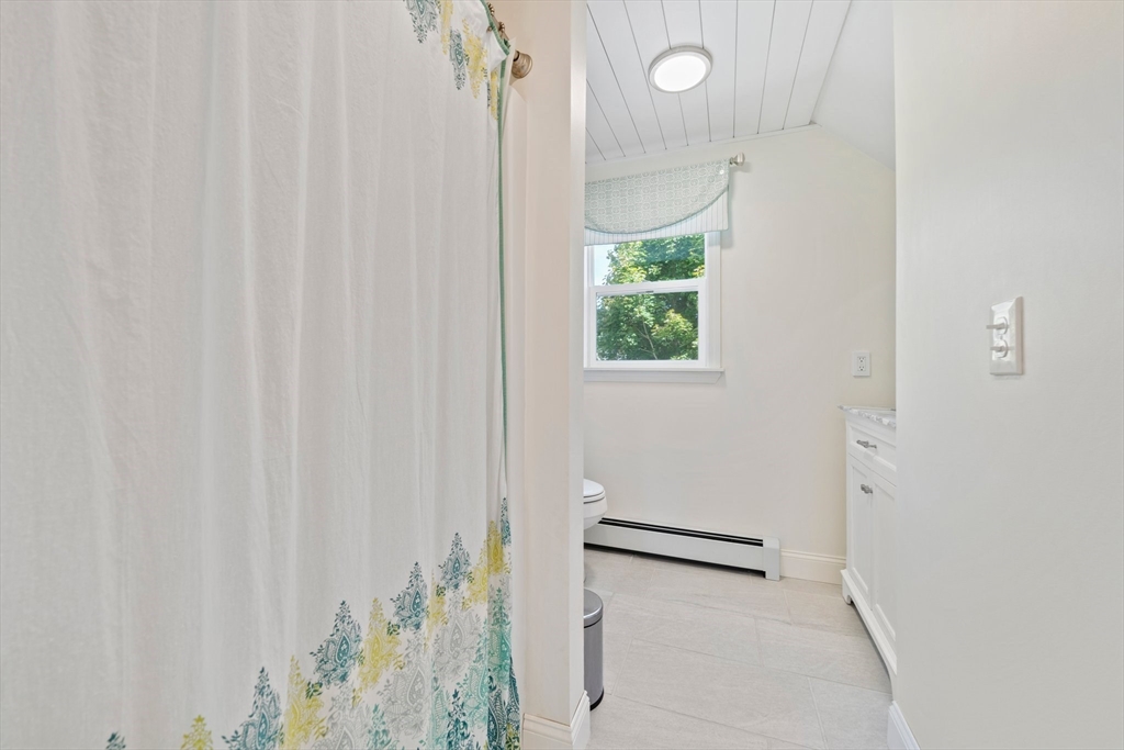 103 Williston Road Bourne, MA 02562 - Photo 22 of 40 a bathroom with a shower and a window